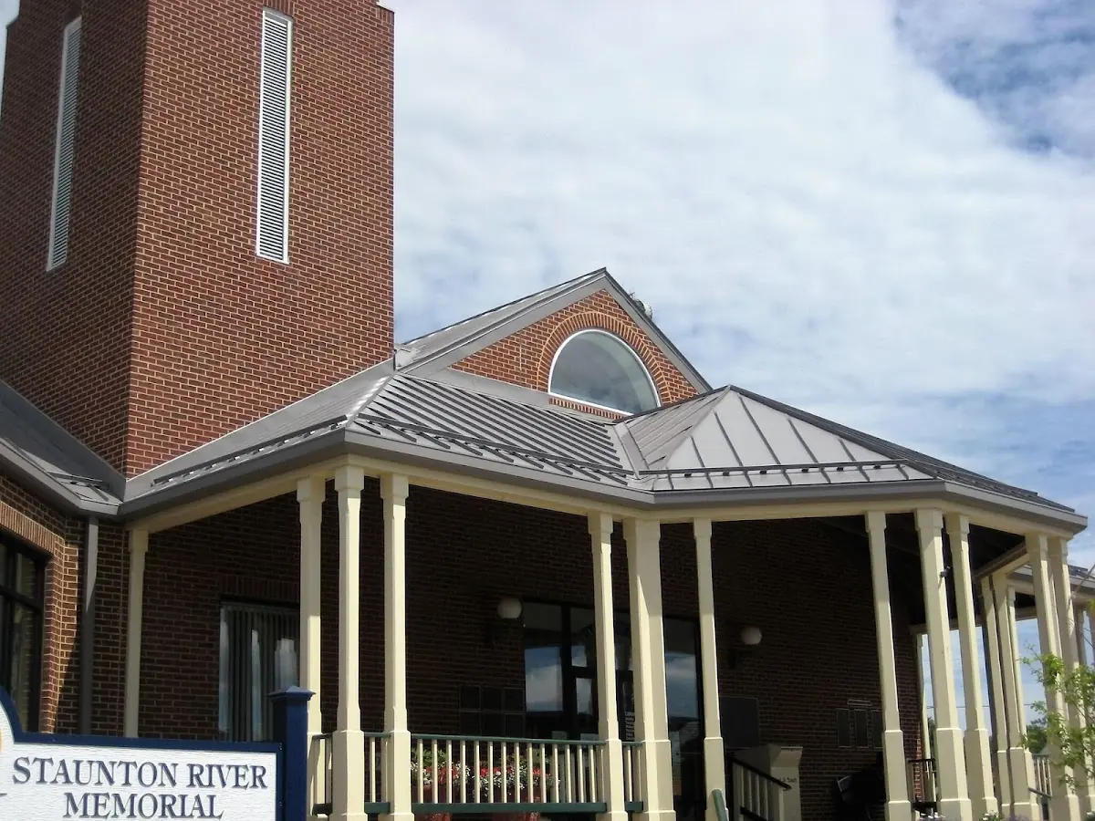 Skilled roofing craftsmen working on a residential roof in St. Marys